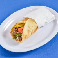 Beef Shawarma wrap  · Our mouthwatering shawarma wrapped in warm pita bread and stuffed with thinly sliced onions ...