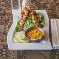 4 Pieces Chicken Satay · Marinated chicken on a skewer with peanut sauce.