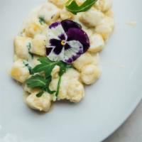 Gnocchi Gorgonzola · Handmade potato gnocchi, Italian Gorgonzola creamy sauce, arugula, honey.