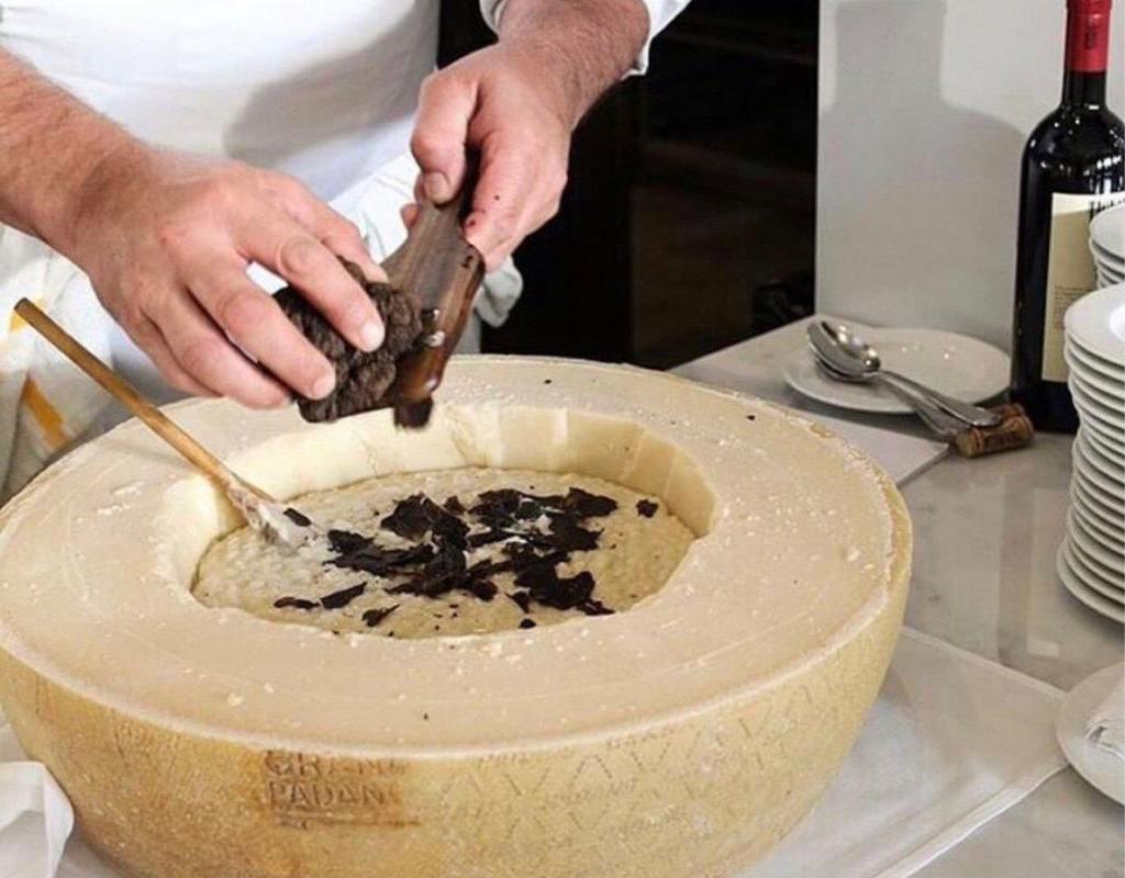 Truffle risotto · Carnaroli rice, butter truffled sauce, fresh Italian black truffle shaved finished in Pecorino cheese wheel.