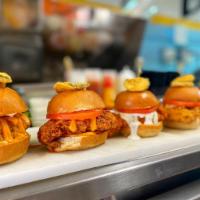 3 Chicken Sliders · Crispy tender chicken tossed in your choice of mango habanero, Buffalo ranch, spicy aioli or...