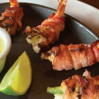 Baja Shrimp Appetizer · 4 jumbo shrimp stuffed with Monterey jack and jalapeno wrapped in bacon,
Served with a frot...