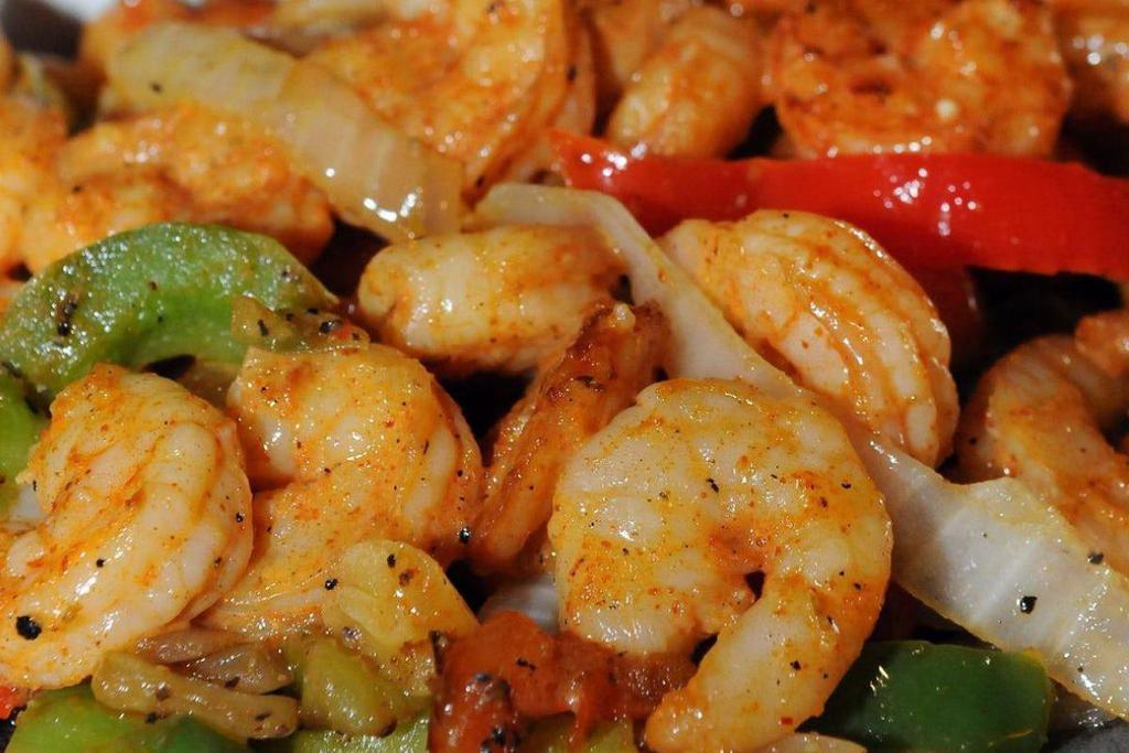 Fire-Grilled Garlic Shrimp Fajitas For 1 · Fire-Grilled Garlic Shrimp with fresh guacamole, sour cream, cheese, pico de gallo, Mexican rice, frijoles a la charra, sautéed peppers and onions with our homemade flour tortillas