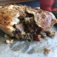 Pork & Green Chili Pie · Tender pork in a spicy sauce with green chili, red bell peppers, and grilled corn, in a butt...