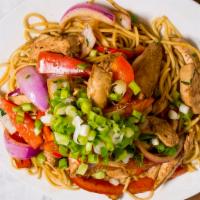 Tallarin Saltado con Pollo · A juicy Chinese influenced Peruvian dish made with spaghetti sauteed tender chicken, red oni...