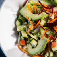 Green Salad · Mixed greens, avocado, red beet, carrots, cucumber & lemon cilantro vinaigrette dressing.