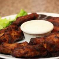 Chicken Wings · These wings will leave you steaming and looking for a cool drink. Your choice of hot, BBQ, I...