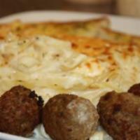 Baked Fettuccini Formaggio · Fettuccini noodles and meatballs in our own Alfredo sauce, baked with mozzarella, feta, Parm...
