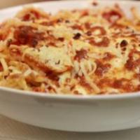 Four Cheese Baked Spaghetti · Baked spaghetti noodles in our homemade marinara sauce topped with mozzarella, feta, Parmesa...