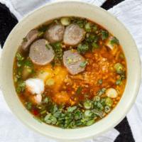 Kasoy Noodle · Flat noodle, beef broth, meatballs, shrimp, ground pork, green onions and cilantro. 