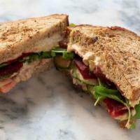 #10 - Veggie · Hummus, tomato, cucumber, pickled beet, red onion and watercress on toasted multigrain.