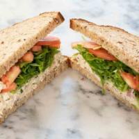 #13 - Tuna Salad · Our famous tuna salad on toasted multigrain with arugula & tomato.  Add cheese and make it a...