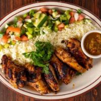 CHICKEN WINGS KABAB  · Grilled chicken wings marinated 
in fresh Afghan spices and seasoning