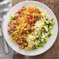 Cobb Salad · Crisp romaine lettuce, crumbled bacon, chopped egg, tomato & corn salsa, cheddar cheese and ...