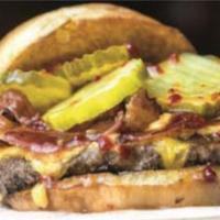 The Southern Burger · Topped with pimiento cheese, bacon, pickles and spicy sweet chili sauce.