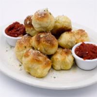 Garlic Knots · Tender knots of dough baked to perfection and tossed with garlic olive oil, fresh garlic and...