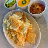 Chips and Dip · Spicy green chile queso and salsa fresca with warm tortilla chips.