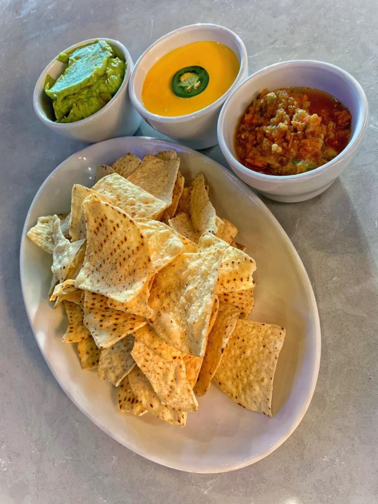 Chips and Dip · Spicy green chile queso and salsa fresca with warm tortilla chips.