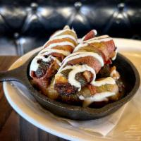 Vampire Jalapeno Poppers · Spicy jalapeños stuffed with our Signature Vampire Dip and wrapped in Hardwood Smoked Bacon,...