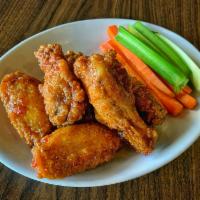 Wings · Classic or boneless. Hand breaded and twice fried for maximum crunch, tossed in 1 of our sig...