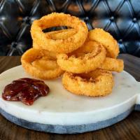 Crispy Onion Rings · Served with BBQ sauce.