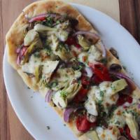 Vampire Veggie Flatbread · Slathered with vampire dip and piled with artichoke hearts, roasted red peppers, mushrooms a...