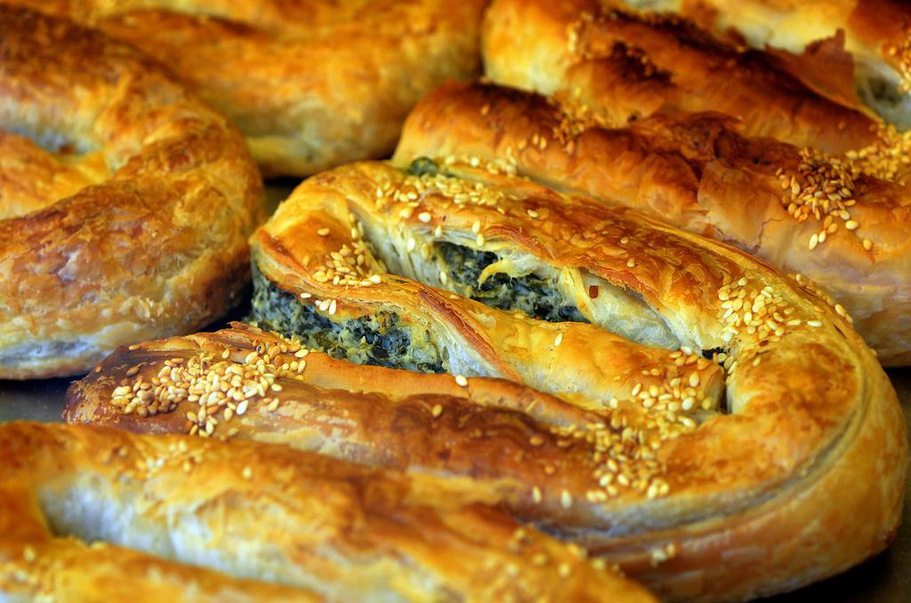 Borek Sml · Savory pastry stuffed with your choice of spinach and feta, ground beef and potatoes, or chicken and carrots.  Comes with cacik. Cacik is similar to a tzatziki sauce, but has more body. Hint of garlic, dill and parsley.