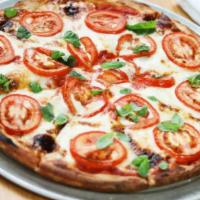 Queen Pizza · Tomato sauce, fresh mozzarella, tomato, fresh basil.
