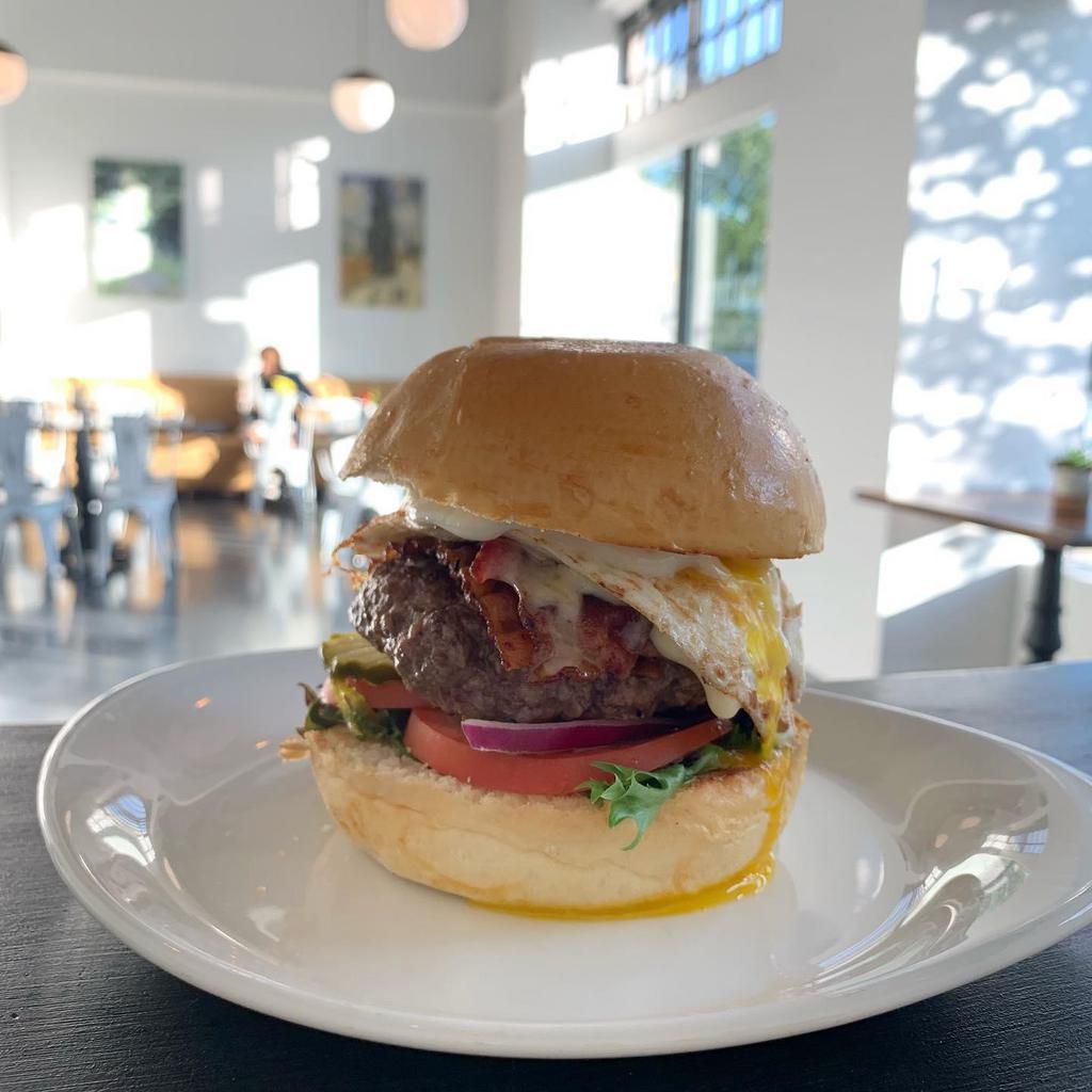 Babo Burger · Two Grass-Fed Beef Patties, American Cheese, Smoked Bacon, Fried Egg, Lettuce, Tomato, Onion, Pickle, Thousand Island, Challah Bun