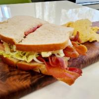 Turkey Club · Turkey, bacon, lettuce, tomato and mayo on choice of toasted bread with a choice of a side.