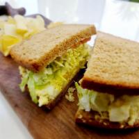 Egg Salad Sandwich · Egg salad, lettuce, tomato and mayo on choice of bread with the choice of a side. ￼