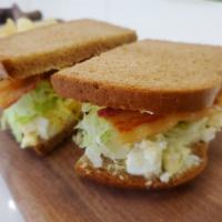 Egg Salad and Bacon Sandwich · Egg salad, bacon, lettuce, tomato and mayo on choice of bread with the choice of a side. ￼