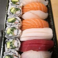 Sushi Regular · Seven pieces of sushi and a California roll. Served with miso soup or salad.