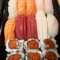 Sushi Deluxe · Nine pieces of sushi and a spicy tuna roll. Served with miso soup or salad.