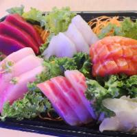 Sashimi Regular · 15 assorted of prepared raw fish. Served with miso soup or salad.