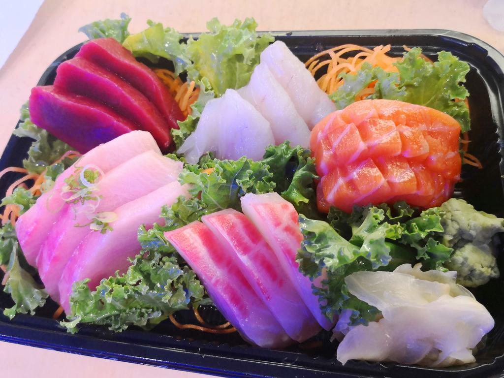 Sashimi Deluxe · 18 assorted of prepared raw fish. Served with miso soup or salad.