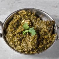 Saag Paneer · A blend of creamy spinach and home made cheese  cubes cooked in spices.