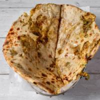 Aloo Paratha · Whole wheat bread stuffed with mildly spiced potatoes. Vegan.