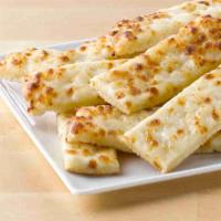 Cheesesticks · Fresh dough topped with special garlic sauce and mozzarella cheese, then baked fresh. Includ...