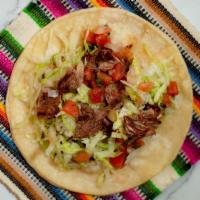 Grilled Steak Taco · Grilled marinated steak, pico de gallo and lettuce.