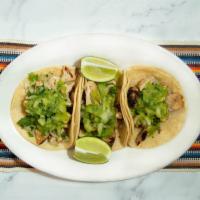 Azteca Tacos · 3 traditional Mexican-style tacos. Choice of filling with cilantro, onions and guacamoltio s...