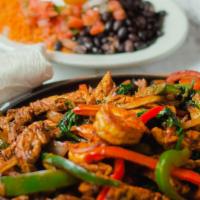 El Patron Fajita Platter · Shrimp, steak, chicken and spinach sauteed with bell peppers, onions and mild chef sauce. Se...