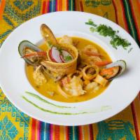 Ceviche Mixto con Concha Negra · Camaron, pescado, pulpo y conchas negras. Mix ceviche with black clams. Shrimp, fish, octopu...