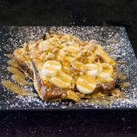 Curious George French Toast · Coconut cream, banana, roasted coconut flakes, walnut and salted caramel sauce.
