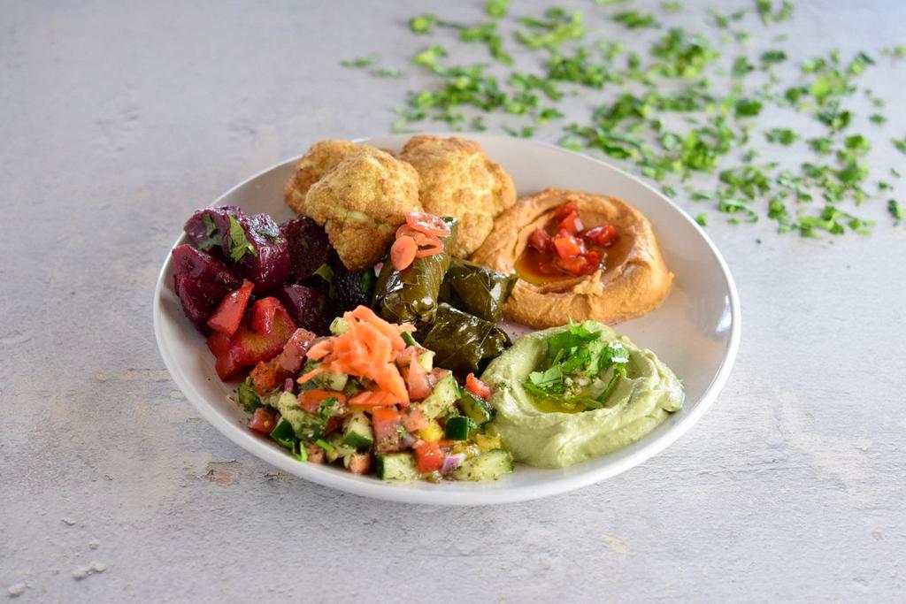 Veggie Sampler · Your choice of one dip, two salads, two veggies, and rice. All platters served with two pitas.