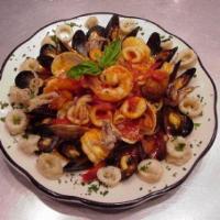 Seafood Pescatore with Pasta · Mussels, clams, shrimp, scallops and calamari with linguine and marinara or white wine garli...