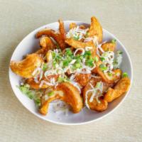 Poutine · Sidewinder fries topped with fresh melted cheese curds, beef gravy and topped with green oni...