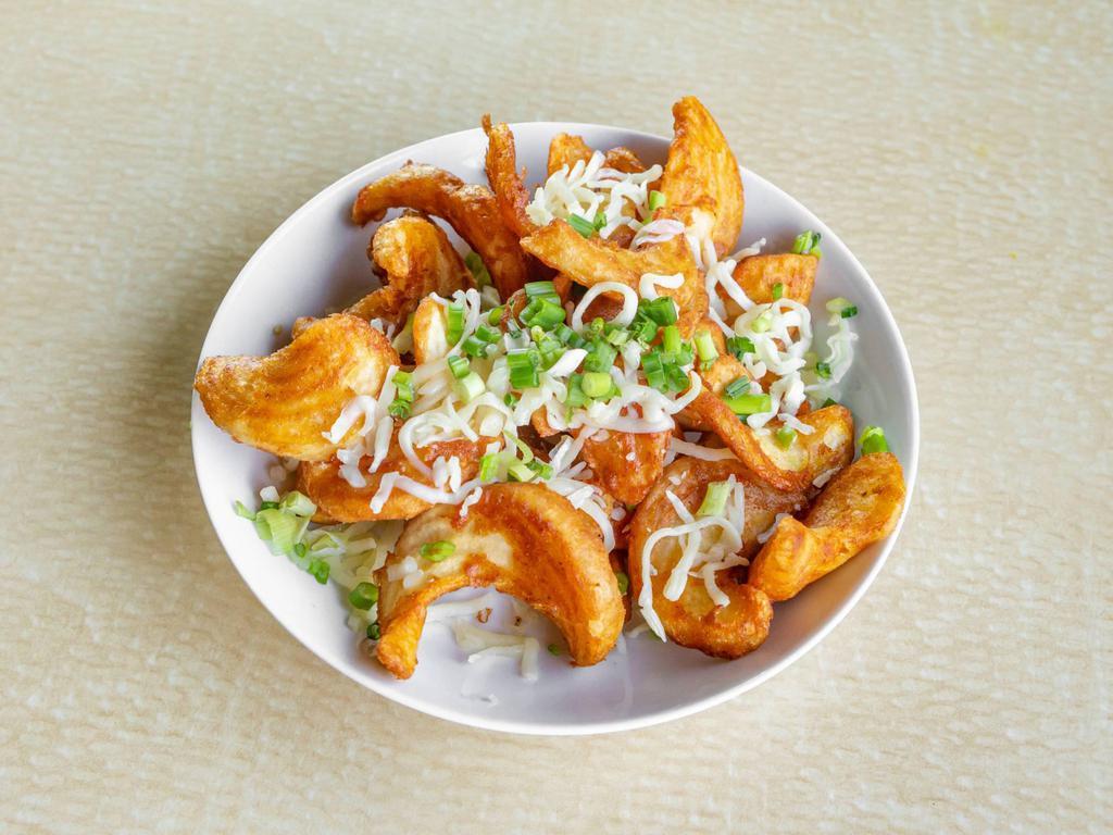 Poutine · Sidewinder fries topped with fresh melted cheese curds, beef gravy and topped with green onions.