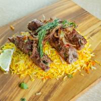 Lamb Kebabs · Ground lamb mixed with a unique blend of spices and cooked in an Indian clay oven with a tan...