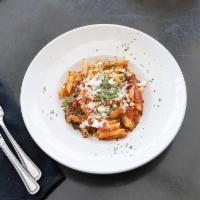 Rigatoni Pomodoro · Garlic, fresh basil, tomato sauce over house-made rigatoni topped with hand crafted mozzarel...